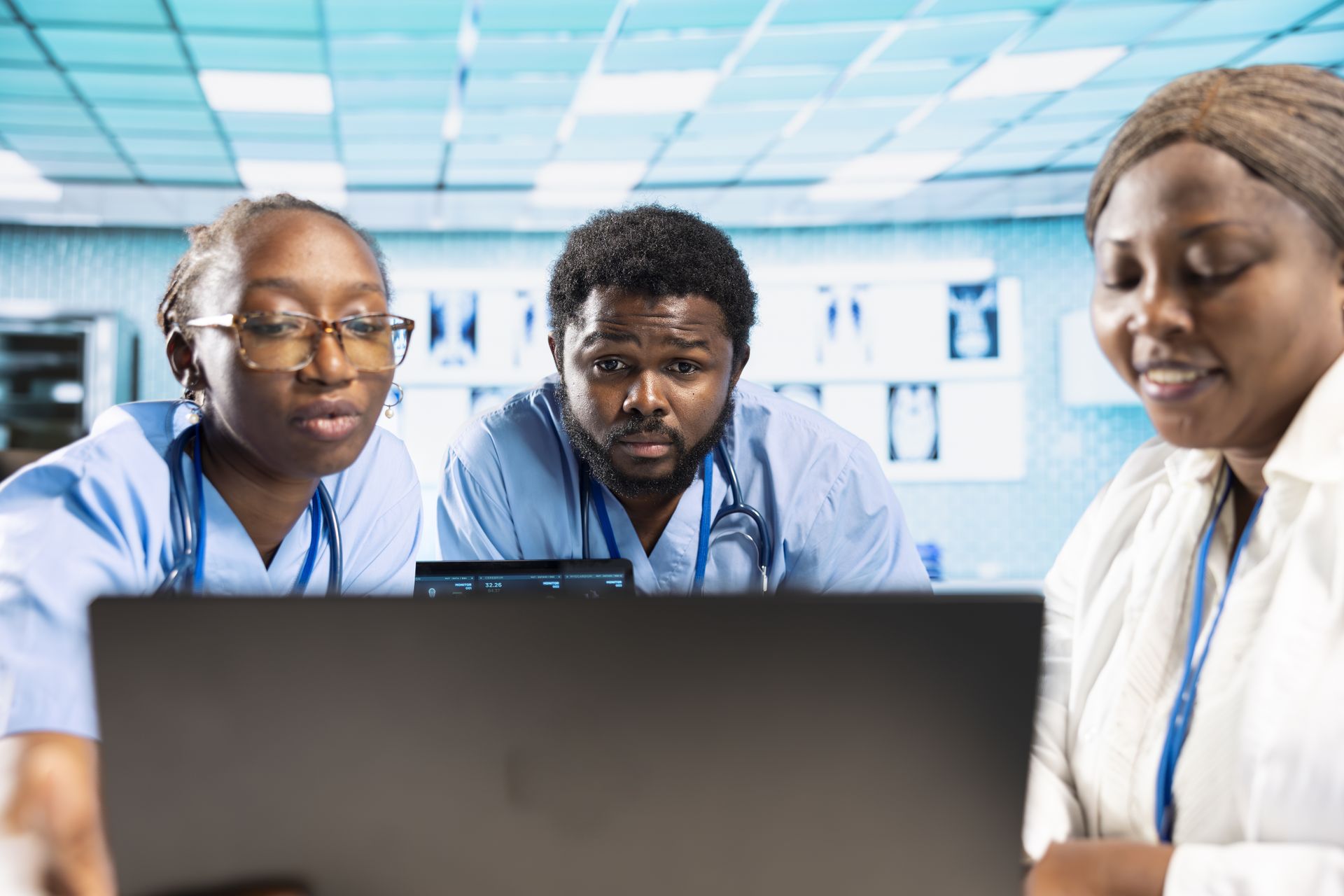Healthcare staff looking a electronic medical records